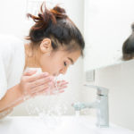 Woman wakes from sleep and she was cleansing the morning before shower