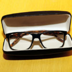 Stylish Eyeglasses in briefcase isolated